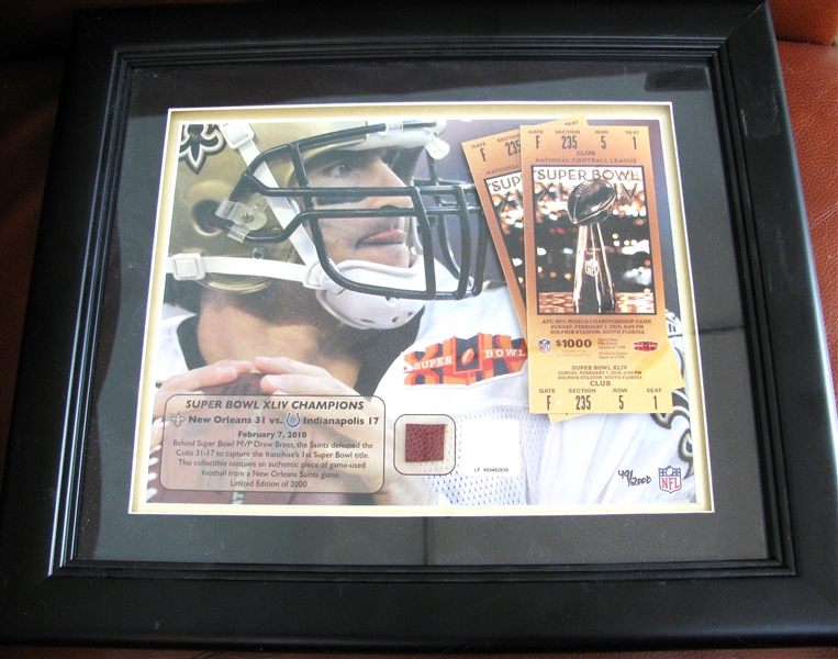 NEW ORLEANS SAINTS GAME USED PIECE OF FOOTBALL w/MOUNTED MEMORIES